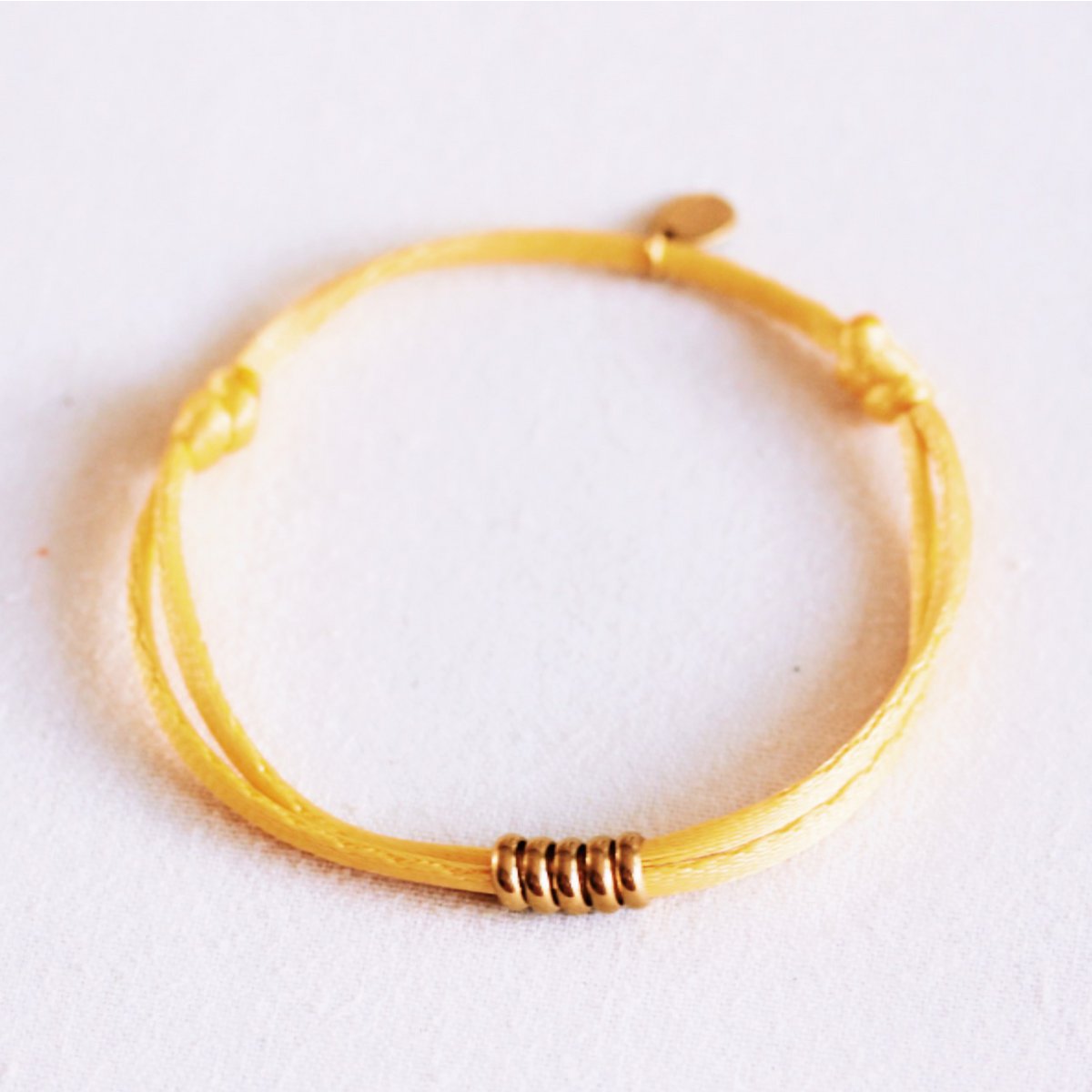 Satin bracelet with rings – yellow/gold