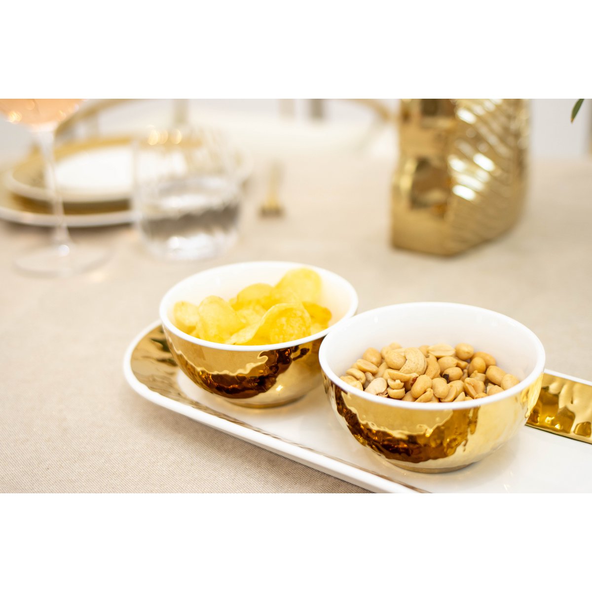 Set of 3 white and golden cups on set