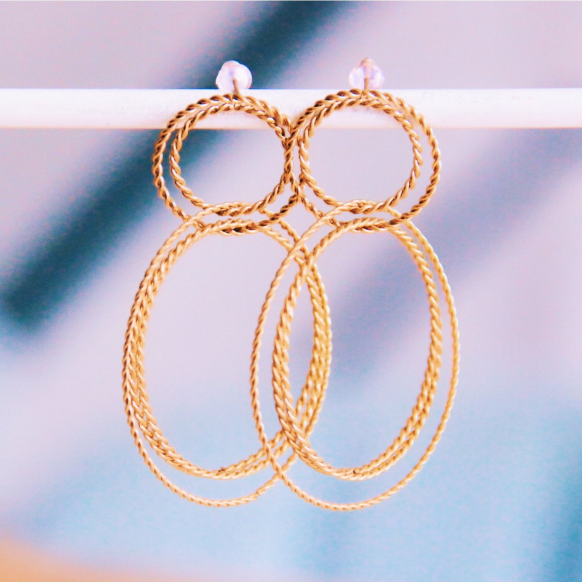 Statement earring round twisted rings