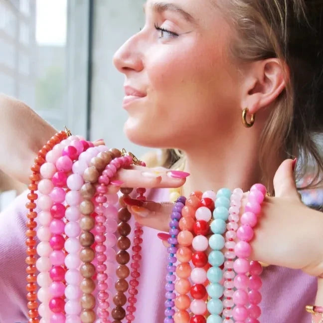 Beaded necklace of natural stone donuts - orange/red