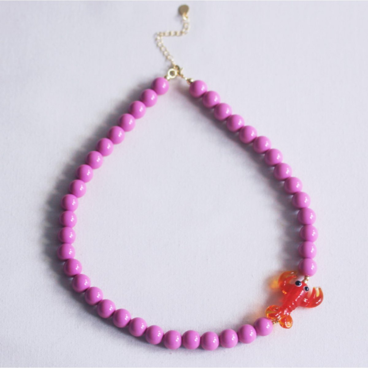 Beaded necklace with lobster - purple