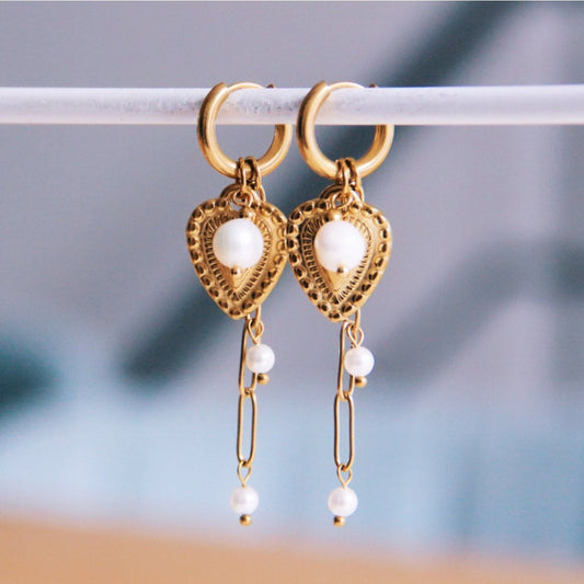 Earring with heart, pearl, and pearl chain