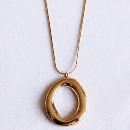 Delicate snake necklace with oval statement pendant