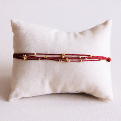 Quadruple satin bracelet with beads - bordeaux
