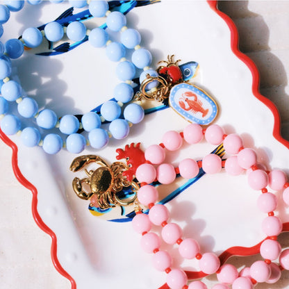 Beaded necklace with Miyuki beads with charms - fuchsia/orange