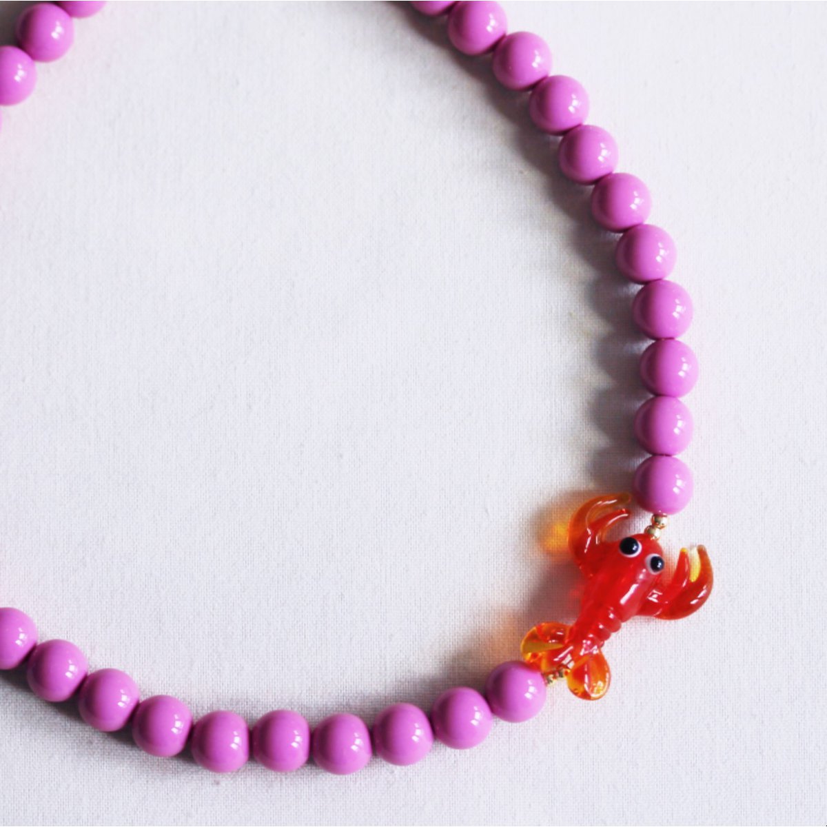 Beaded necklace with lobster - purple