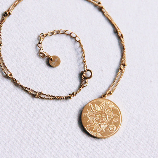 Stainless steel fine chain with balls with moon/sun charm – gold