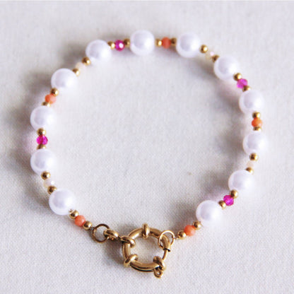 Faceted pearl bracelet with round clasp - pink/orange
