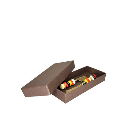 Golden cheese service with multi-colored stone handles