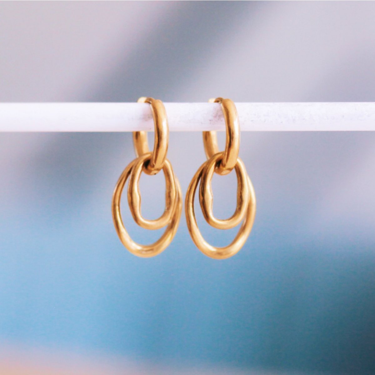 Stainless steel earring with double oval charm
