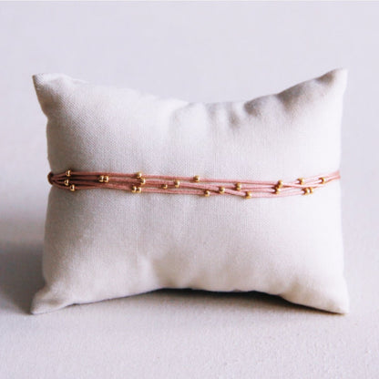 Quadruple satin bracelet with beads - old pink