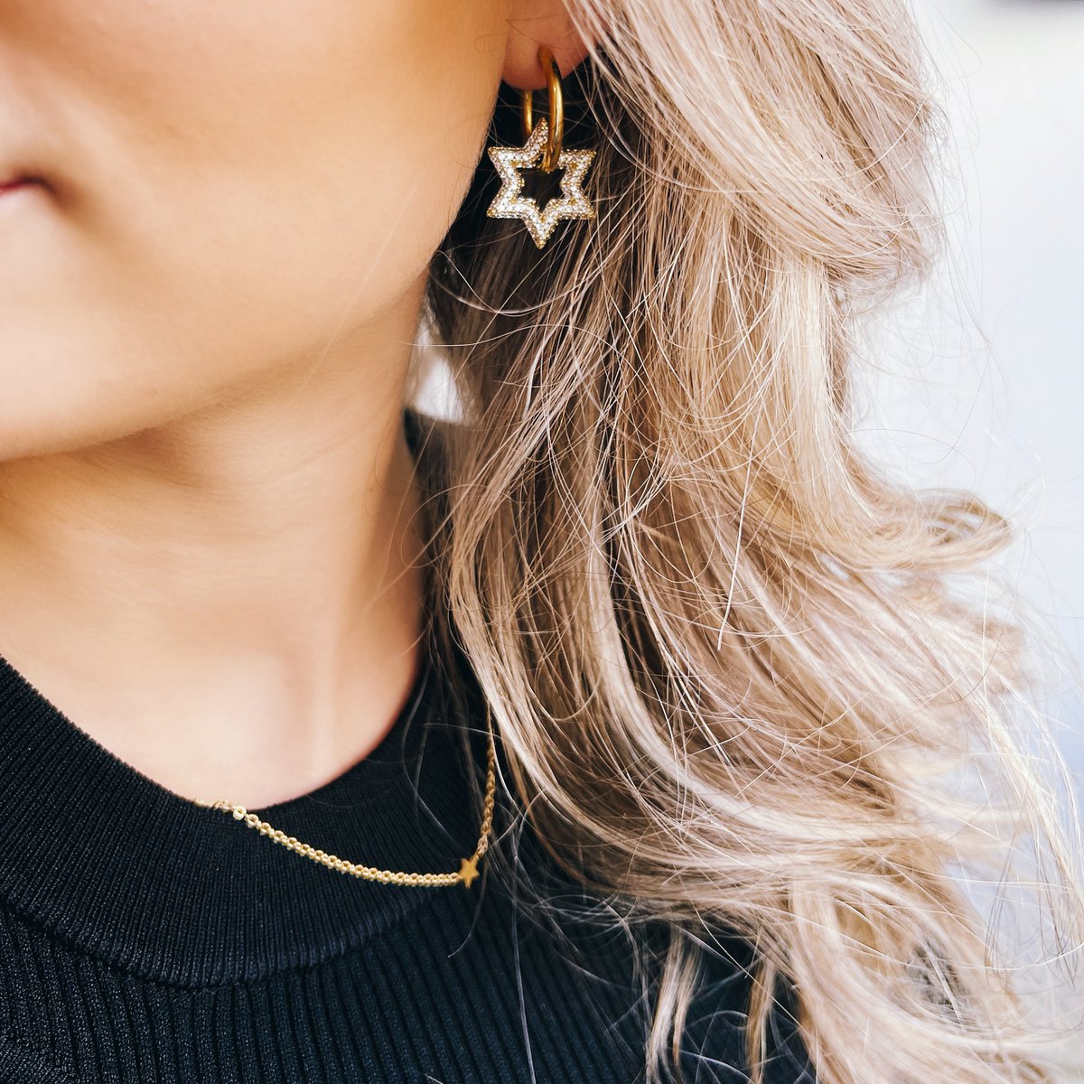 Stainless steel hoop earring with crystal star - silver