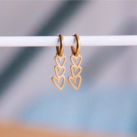 Stainless steel hoops with 3 angled hearts - gold