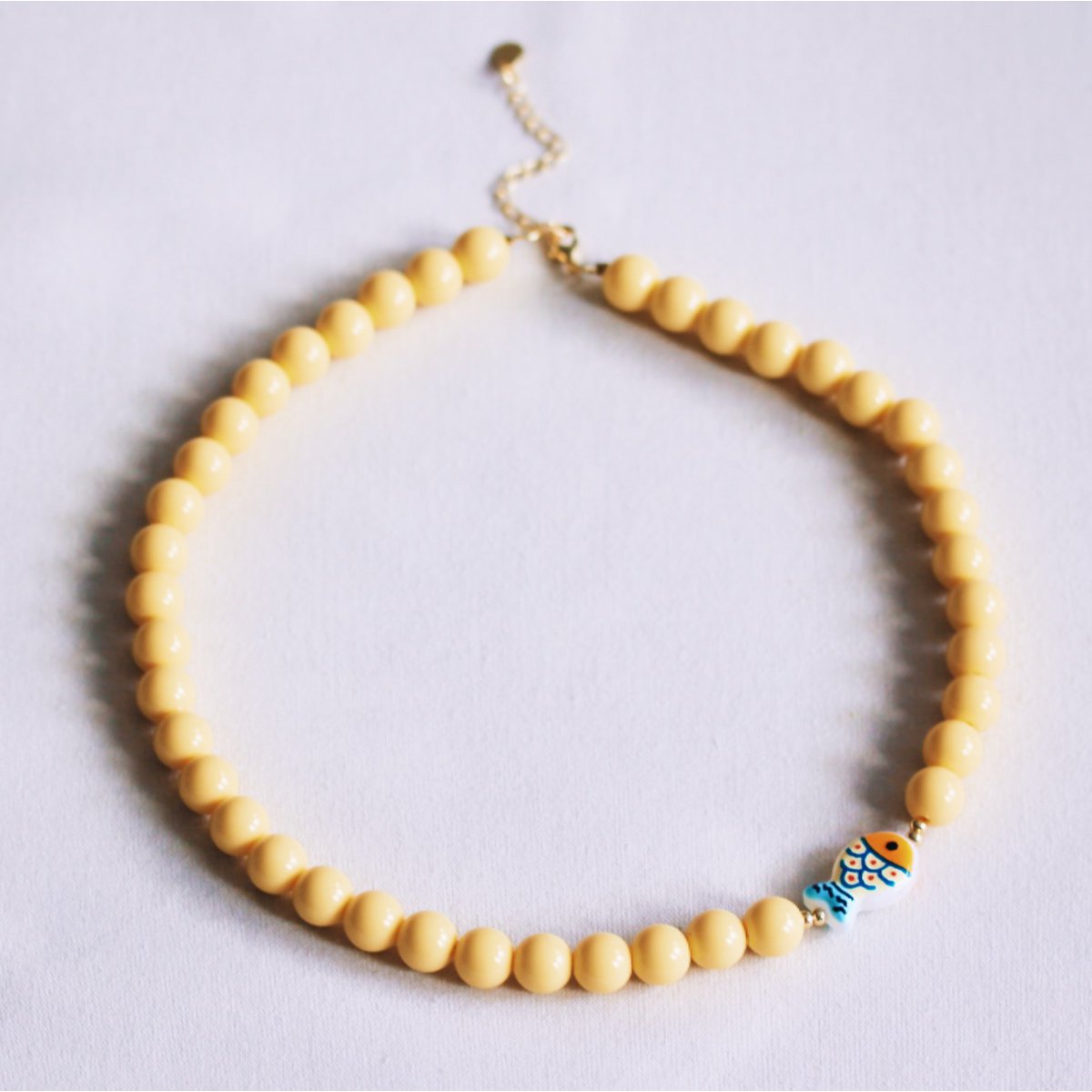 Beaded necklace with fish - yellow