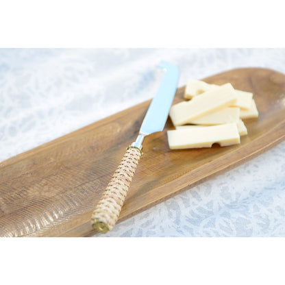 Beige cheese knife with wicker handle