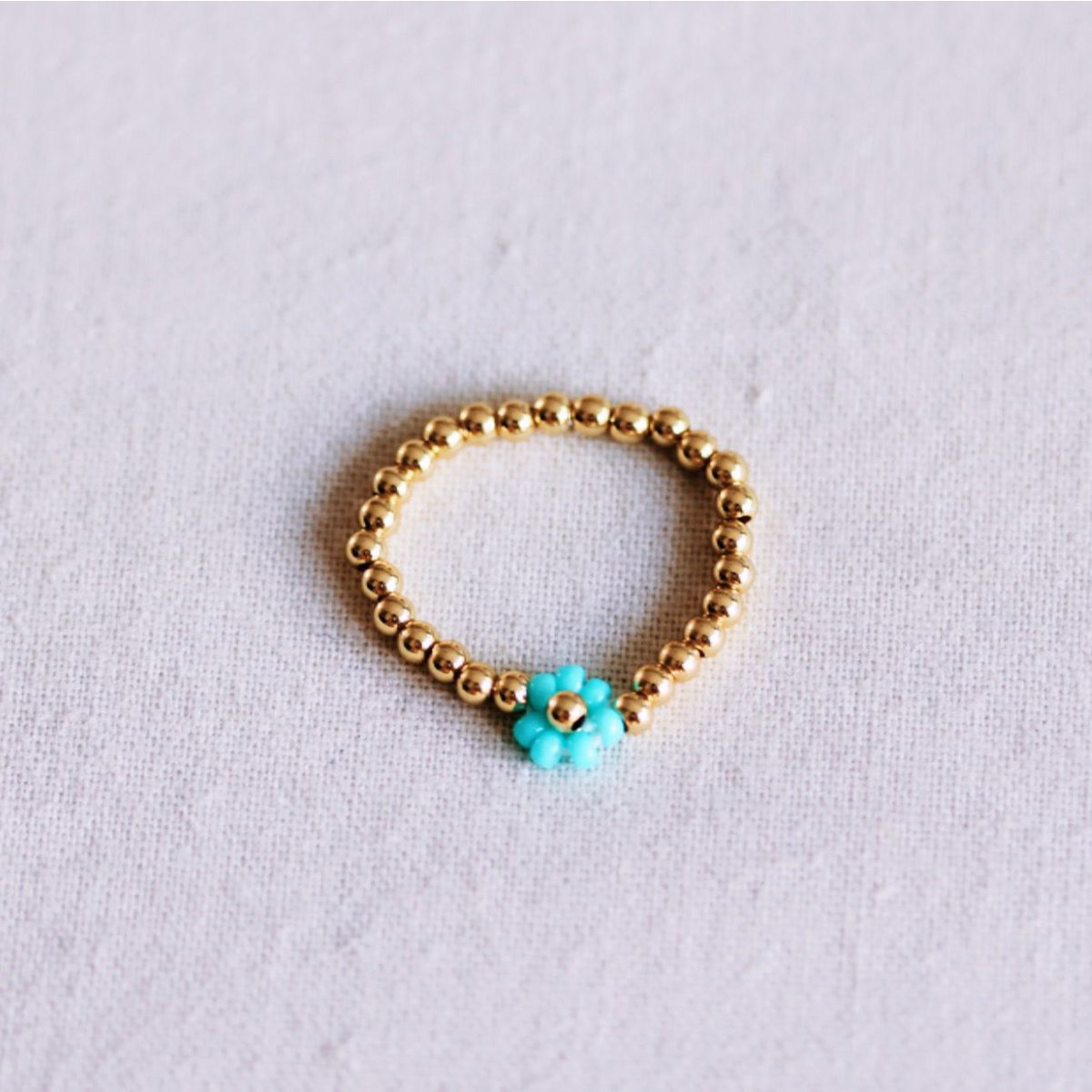 Elastic bead ring with flower - mint