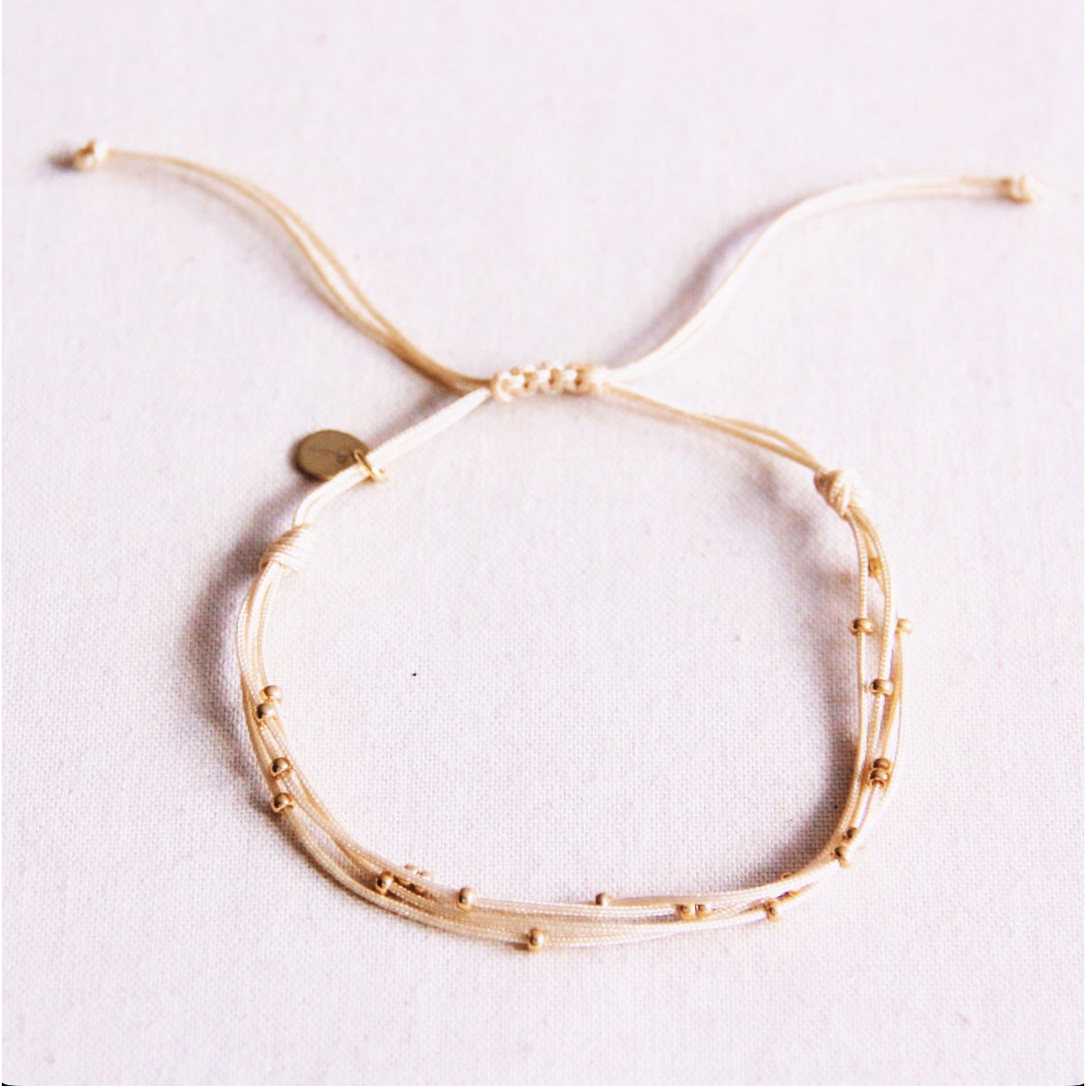 Quadruple satin bracelet with beads - sand