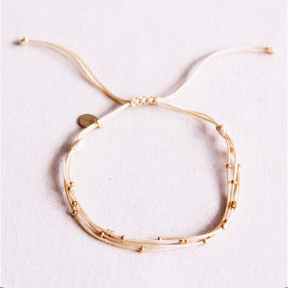 Quadruple satin bracelet with beads - sand