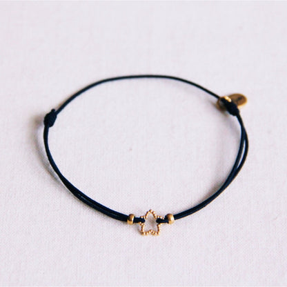Elastic bracelet with dotted star - black