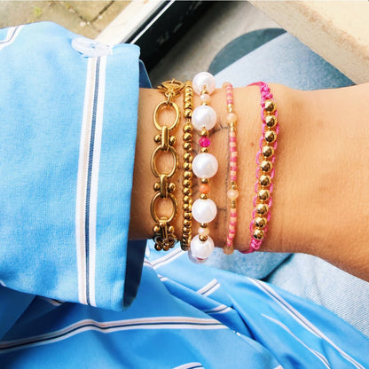 Faceted pearl bracelet with round clasp - pink/orange