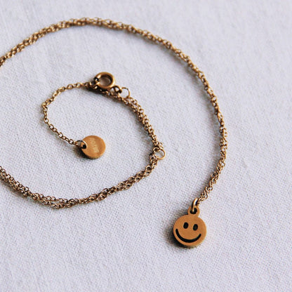 Stainless steel fine chain with smiley - gold