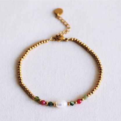 Beaded bracelet with pearl and facets - green/cerise