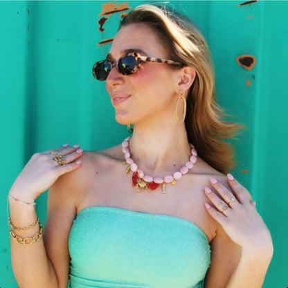 Oval beaded necklace with "Crabby's" charms