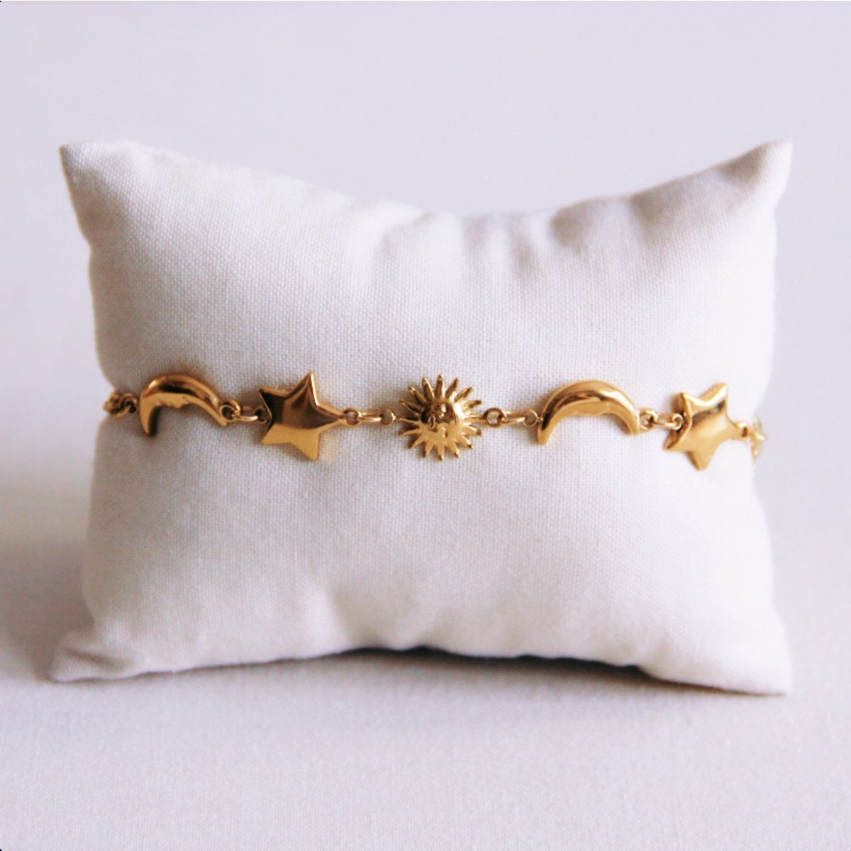 Link bracelet with sun, moon and star