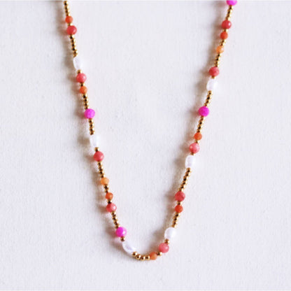 Beaded necklace with pearls and facets - coral/orange/pink