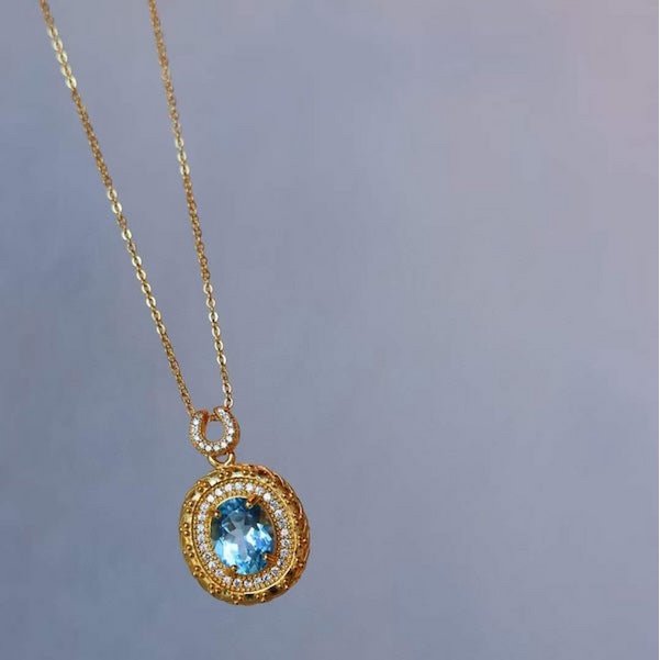 Blue Topaz Gold Framed Oval Pendant Necklace
