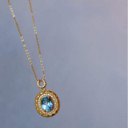 Blue Topaz Gold Framed Oval Pendant Necklace