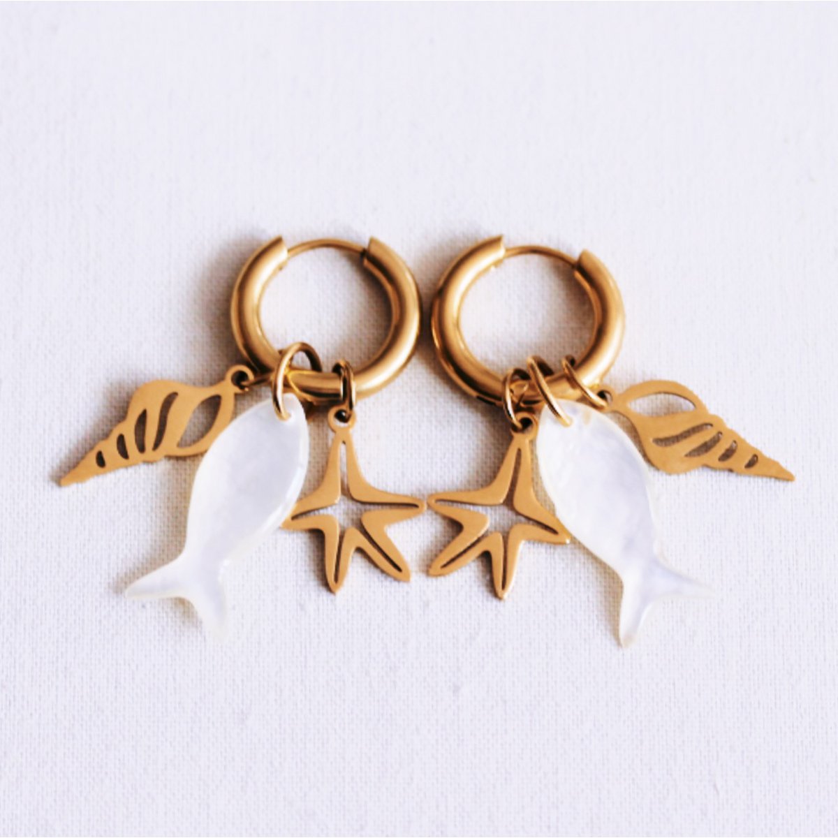 Stainless steel earring with starfish, shell and mother-of-pearl fish