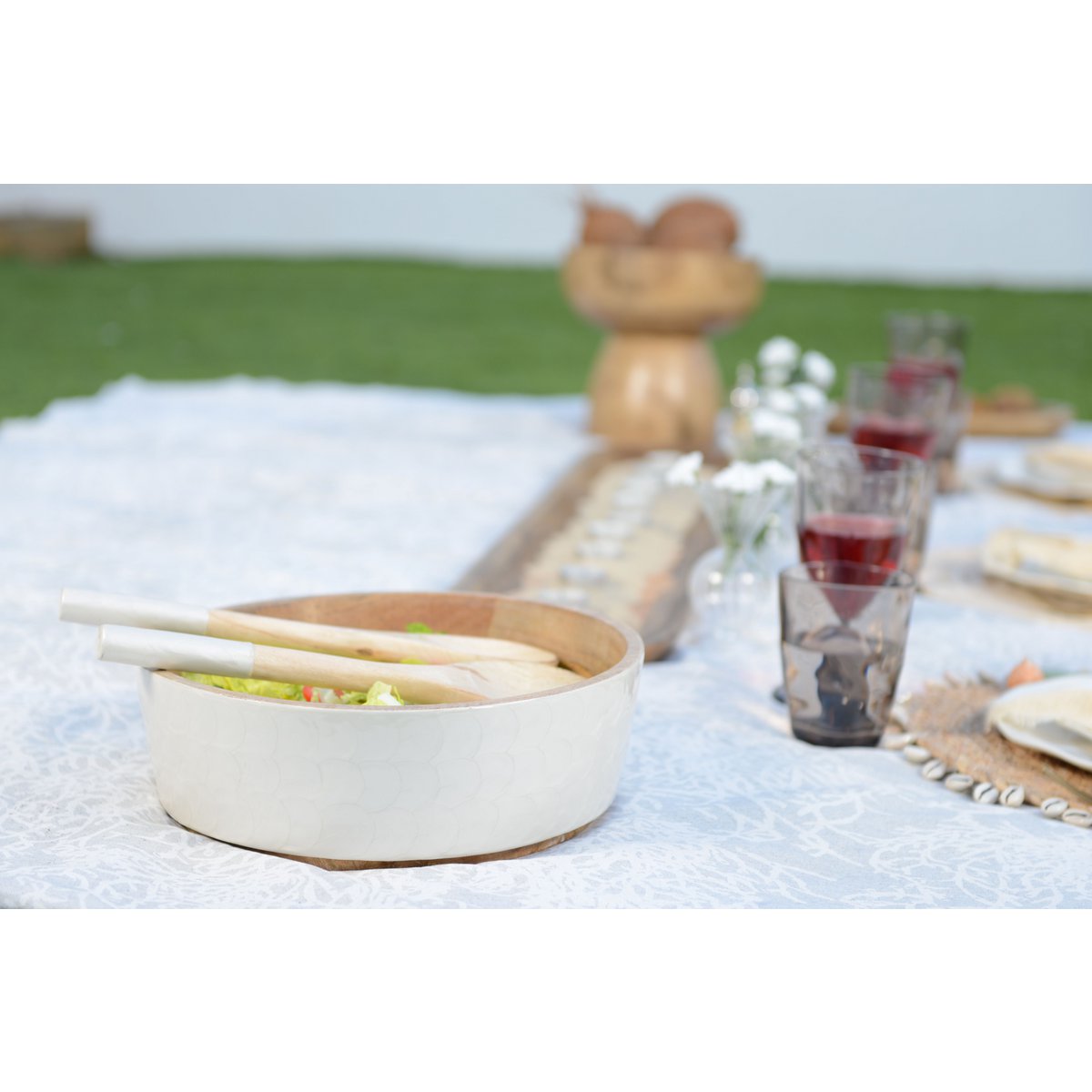 Saladier and white salad and mango salad cutlery