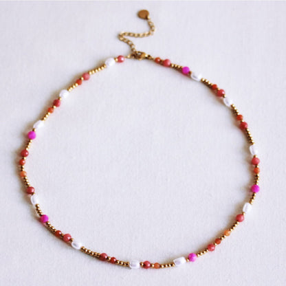 Beaded necklace with pearls and facets - coral/orange/pink