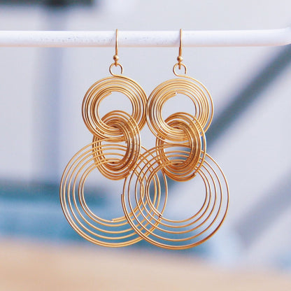 Stainless steel statement earring twisted rings - gold