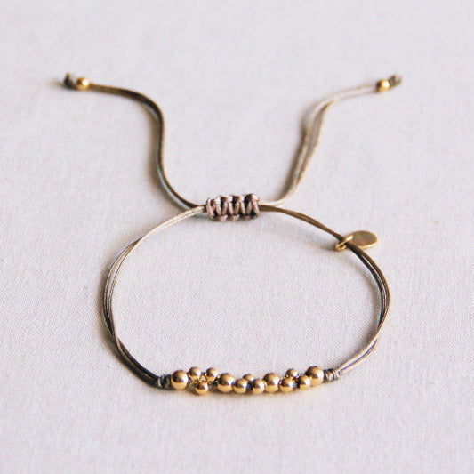 FW107 -  Satin bracelet with gold colored beads - taupe / gold