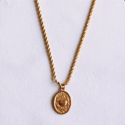 Twisted steel chain with an oval heart charm