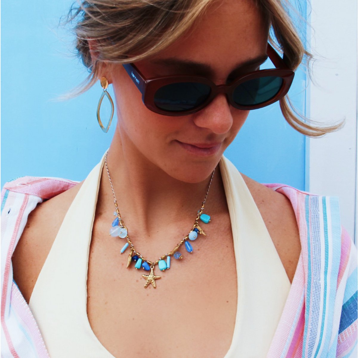 Braided necklace with shell charms and mint/blue stones