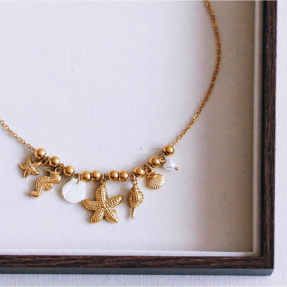 Beaded necklace with ‘Salt & Sea’ charms