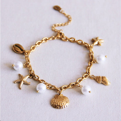 Charm bracelet with shells, starfish and pearls