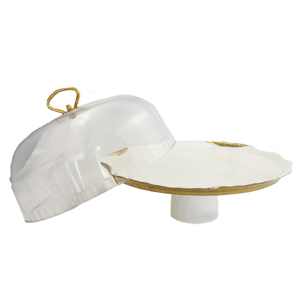 White porcelain cake bell with gold edges with pie shovel