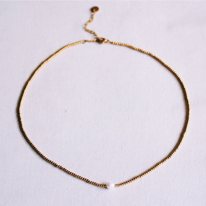 Minimalist beaded necklace with a small pearl