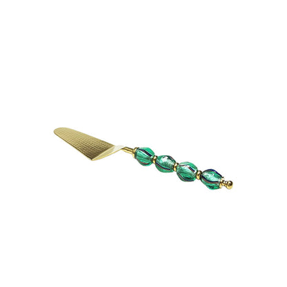 Golden pie server with green pearl handle