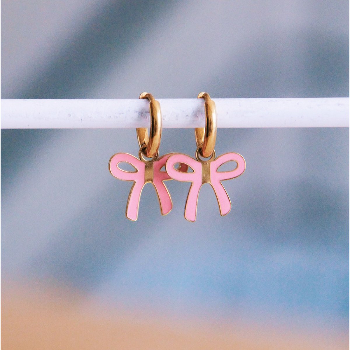 Stainless steel hoop earrings with bow - pink