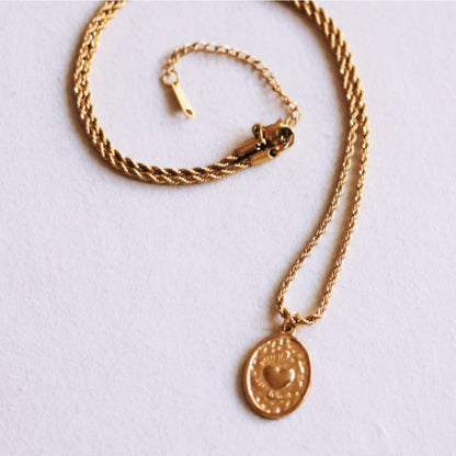 Twisted steel chain with an oval heart charm