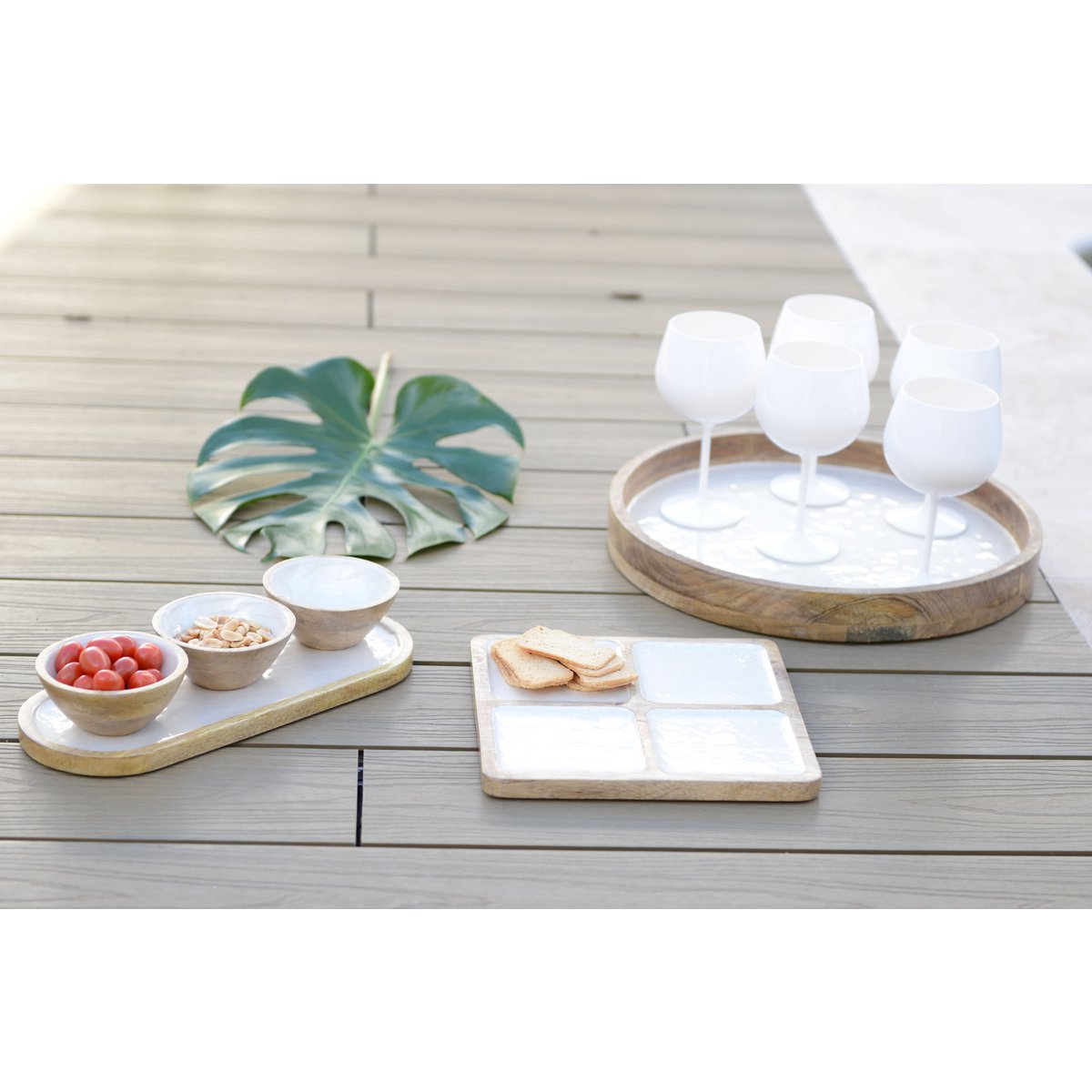 Aperitif set of 3 white cups on white wooden tray