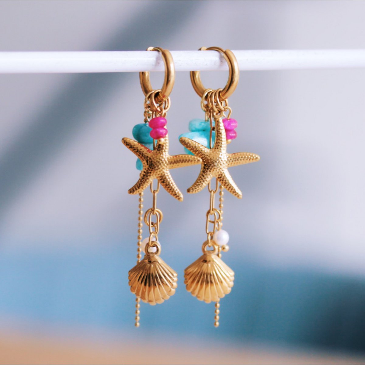 Stainless steel hoop earrings with starfish, shell, chains, and pearl - fuchsia/mint