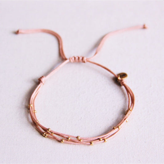 Quadruple satin bracelet with beads - old pink
