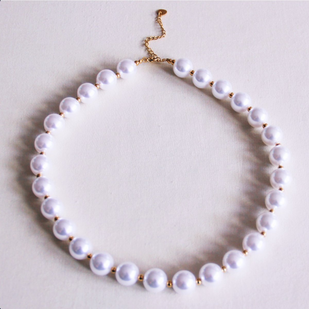 Pearl necklace with gold-colored beads