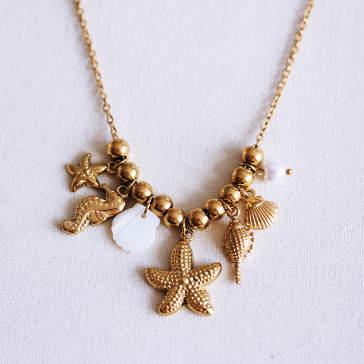 Beaded necklace with ‘Salt & Sea’ charms
